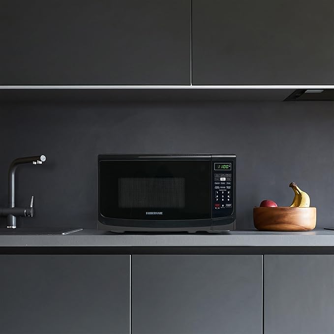 Farberware Countertop Microwave Oven 700 Watts Power Auto Cook Settings, Defrost, Easy Clean and Child Safety Lock, 0.7 Cu. Ft, Black
