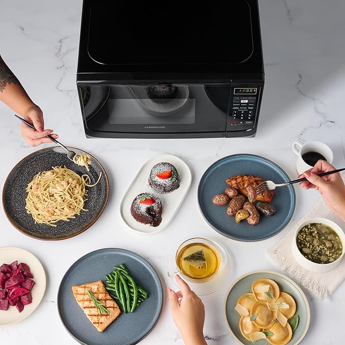 Farberware Countertop Microwave Oven 700 Watts Power Auto Cook Settings, Defrost, Easy Clean and Child Safety Lock, 0.7 Cu. Ft, Black